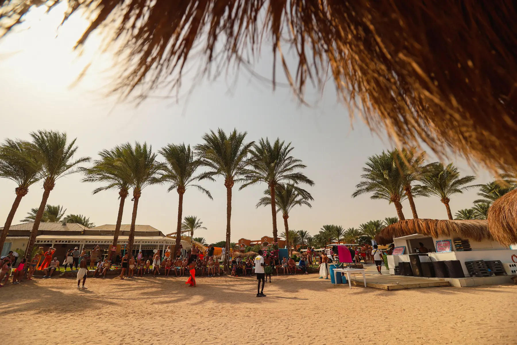 Caribbean World Resort Hurghada beach event with guests and wide coastal view
