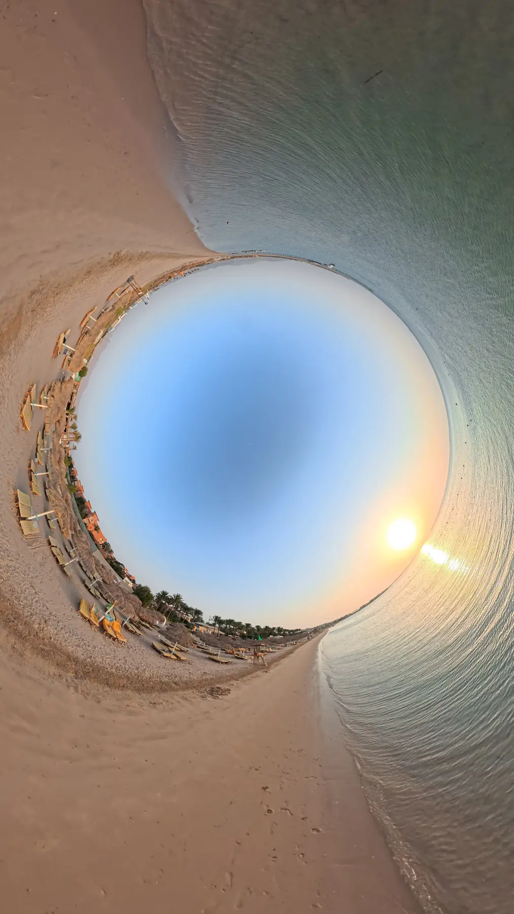 Sunrise over the private beach at Caribbean World Resorts Hurghada captured by VirtuPeek in a 360 tiny planet perspective
