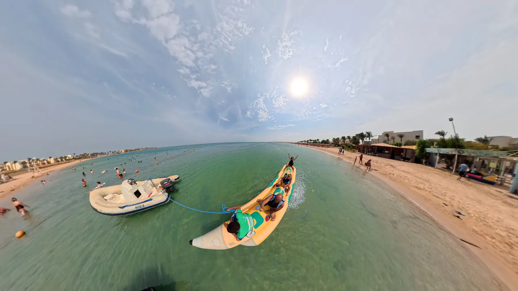 Guests kayaking in clear Red Sea water at Caribbean World Resorts Hurghada captured by VirtuPeek in a wide horizontal view